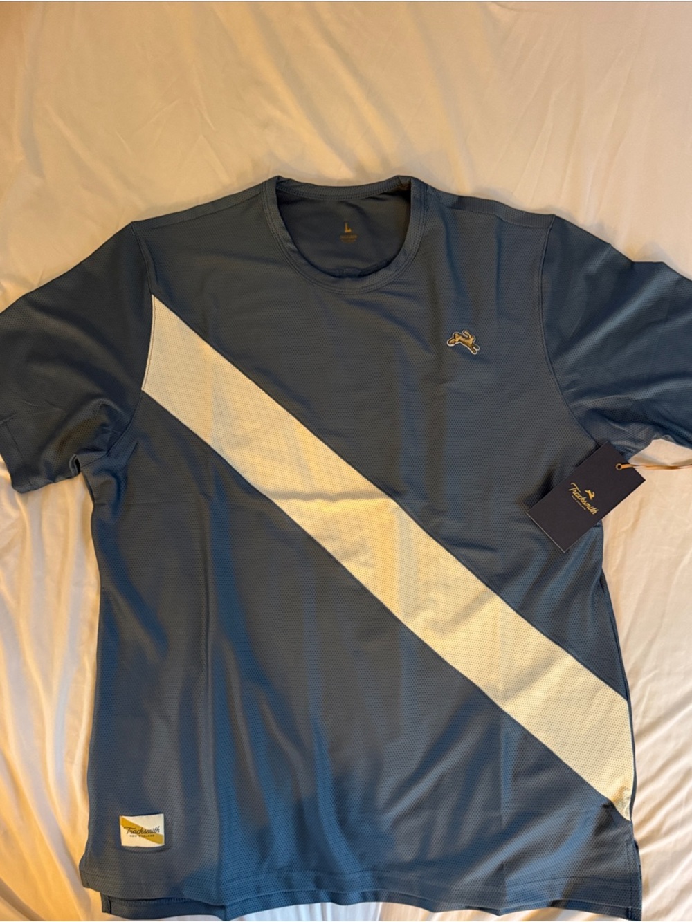 Tracksmith Blue Short Sleeve Performance Tee with White Diagonal Stripe